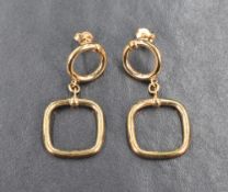 A pair of 9ct gold drop earrings, the circular tops with post backs, followed by square drop