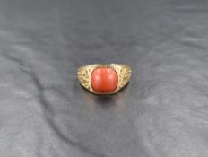 A red jasper signet style ring, the jasper cabochon in a slight bezel setting, with decorative