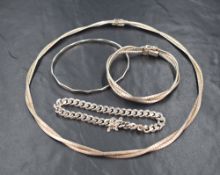 A silver collarette style double band articulated necklace with matching silver 3 band plaited