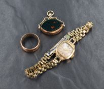 A 9ct gold spinner fob, having blood stone and carnelian sides, sold along with a gold cased