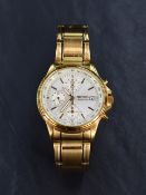 A Seiko chronograph wristwatch, the white dial with baton five minute markers, date aperture and