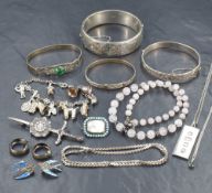 A selection of silver jewellery, including bracelets of various size and design such as a charm