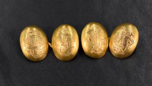 A pair of 18ct gold cufflinks, of domed oval form having 'BTC' monogram engraved to each panel