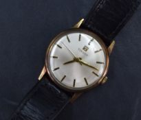 A gent's Tissot 9ct gold manual wristwatch having a baton numeral dial on silvered face in a plain