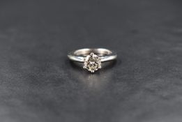 A diamond solitaire ring, the round brilliant cut diamond being approx 1ct in a 6 claw raised