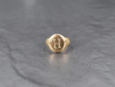 A gent's 9ct gold signet ring bearing a letter H monogram, size P & approx 5.3g