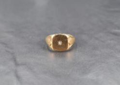 A gent's 9ct gold signet ring having a small diamond inset in a shield panel, size U & approx 7.2g