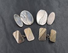 Two pairs of silver cufflinks, one being hand crafted with decorative front oval panels and bar