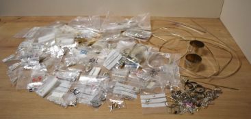 A large quantity of jewellery making silver/white metal, including fittings, chains, wire, clasps,