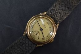 A 9ct gold cased Avia wristwatch, the champagne dial with baton and Roman numerals, having a