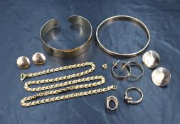 An assortment of yellow metal jewellery, some marked 9ct, including stud earrings, bangles and a