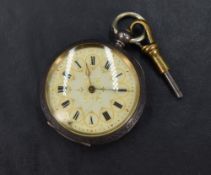 A small open face key wound pocket watch, the white dial having Roman numerals within gold circles