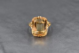 An impressive citrine ring, the cushion cut citrine measuring 14.2mm W x 17.8mm L x 8.5mm D, in a