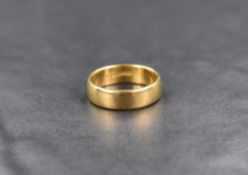 An 18ct gold wedding band, size K & approx 5.2g