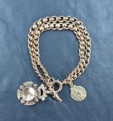 A 9ct gold double modified curb link bracelet, having a 9ct gold dog clip, a 9ct gold St Christopher