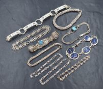Ten silver and white metal bracelets of various forms including filligree & Siam style