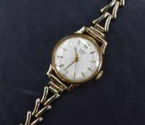 A lady's 1960's 9ct gold wrist watch by Tudor having Rolex case no:404322, baton numeral dial with