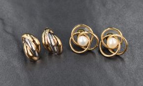 Two pairs of 9ct gold earrings, one of a two-tone banded wave design, the other of an openwork