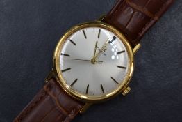 A gent's gold plated Omega wrist watch having baton numeral dial to silvered face on a tan leather