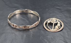 A Charles Rennie Mackintosh design silver bangle and brooch, in original boxes created by Carrick