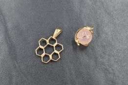 A 9ct gold honey comb motif pendant, sold along with a rose quartz orb pendant, mounted in high