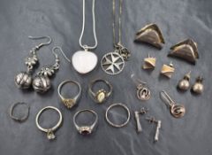 An assortment of silver jewellery, including stud earrings, necklaces, rings and drop earrings, 58.