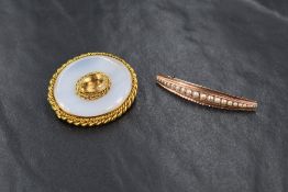 A yellow metal brooch, of oval shape set with agate and a central yellow stone possibly citrine