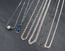 Five white metal chains of various forms, most stamped 925/silver and a lapis lazuli pendant with