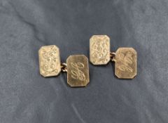 A pair of 9ct gold cufflinks, of rectangular form having decorative scroll engraving to one panel