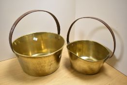 A Victorian brass preserve pan with cast iron handle, measuring 32cm high, and a smaller preserve