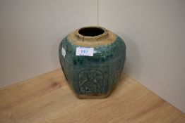 A 19th Century Chinese earthenware domestic or funerary vessel of faceted, spherical form, decorated