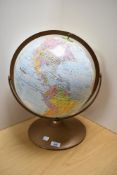 A mid-20th Century Replogle World Nation Series desktop globe, set within a copper coloured and