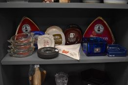 An assorted selection of 20th Century ceramic and glass breweriana, to include a pair of Carlton