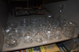 A selection of cut-crystal and glass wares, various including sundae glasses, jugs, decanter, lidded