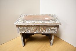 A 19th/20th Century Chinese bleached wood stool, carved in relief with traditional symbols and