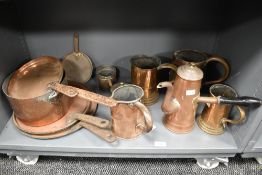 A selection of 19th Century copperware, to include an ebony handled hot chocolate pot, skillets, and