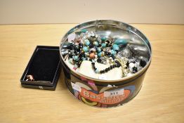 An assortment of costume jewellery, including beaded necklaces, stud earrings, pendants on chains,