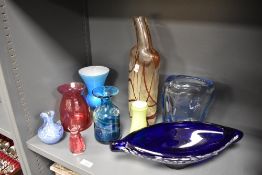 A 20th Century Whitefriars style clear glass vase, of shaped form and measuring 20cm high,