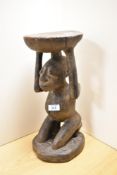 An African tribal carved hardwood caryatid stool, possibly Luba, from Congo (DRC), modelled as a nu