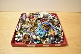 An assorted selection of costume jewellery, to include graduated bead necklaces, brooches, and
