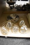 A vintage glass ceiling light fitting with five suspended glass shades