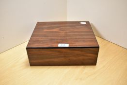 A 20th Century laminated wood humidor, in generally good order and measuring 9cm x 25cm x 21cm
