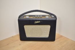 A mid-20th Century Roberts Revival radio with charger