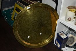 A 19th/20th Century engraved Indian brass tray, of circular form with a diameter of 60cm