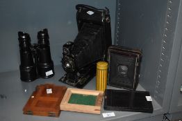 An early 20th Century Kodak JR No. 3A Autograph folding camera, a part field camera and back plates,