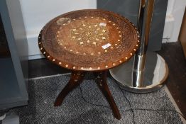A 19th/20th Century Indian mahogany tripod table, the top having bone inlay decoration within a