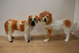 Two 19th Century Staffordshire porcelain St Bernard Dog studies, one having glass amber eyes, each