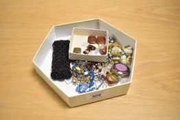 A small selection of costume and other jewellery, including polished gem stones, an early 20th