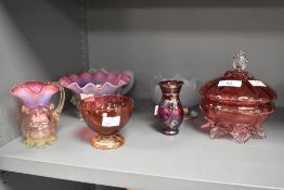 A Victorian cranberry glass lidded bowl, measuring 16cm high, and a selection of other decorative,