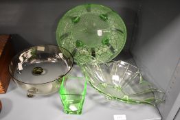 An Art Deco frosted green glass bowl, raised on four downswept legs and having a diameter of 25cm,